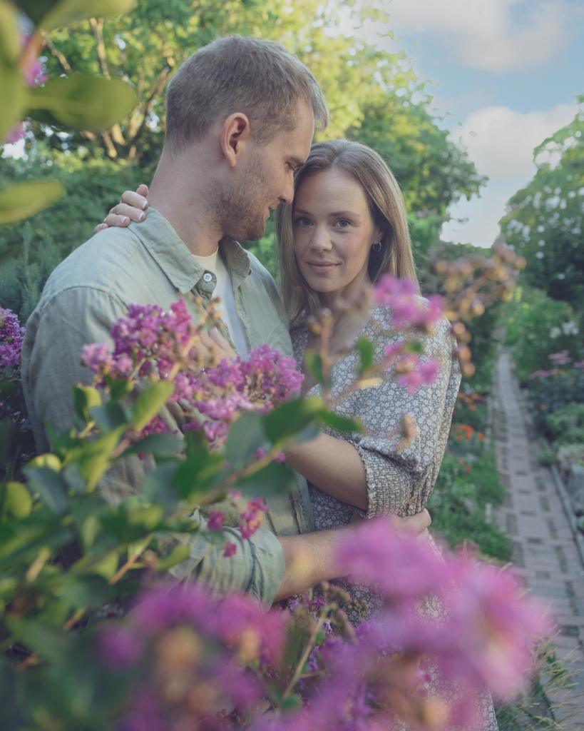 Emily and Liam NYC Upper West Side Engagement shoot walk through garden flowers