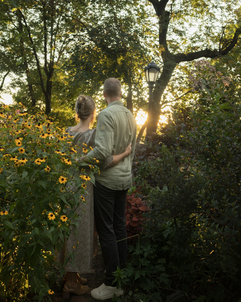 Emily and Liam NYC Upper West Side Engagement shoot walk through garden engagement shoot sunset