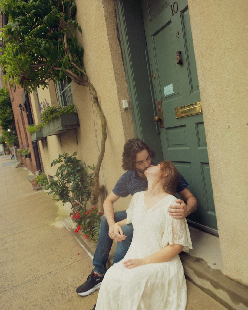 Dreamy New York City couple portraits, sharing a tender kiss at Washington Mews
